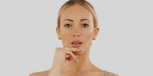 woman demonstrating tmj exercise